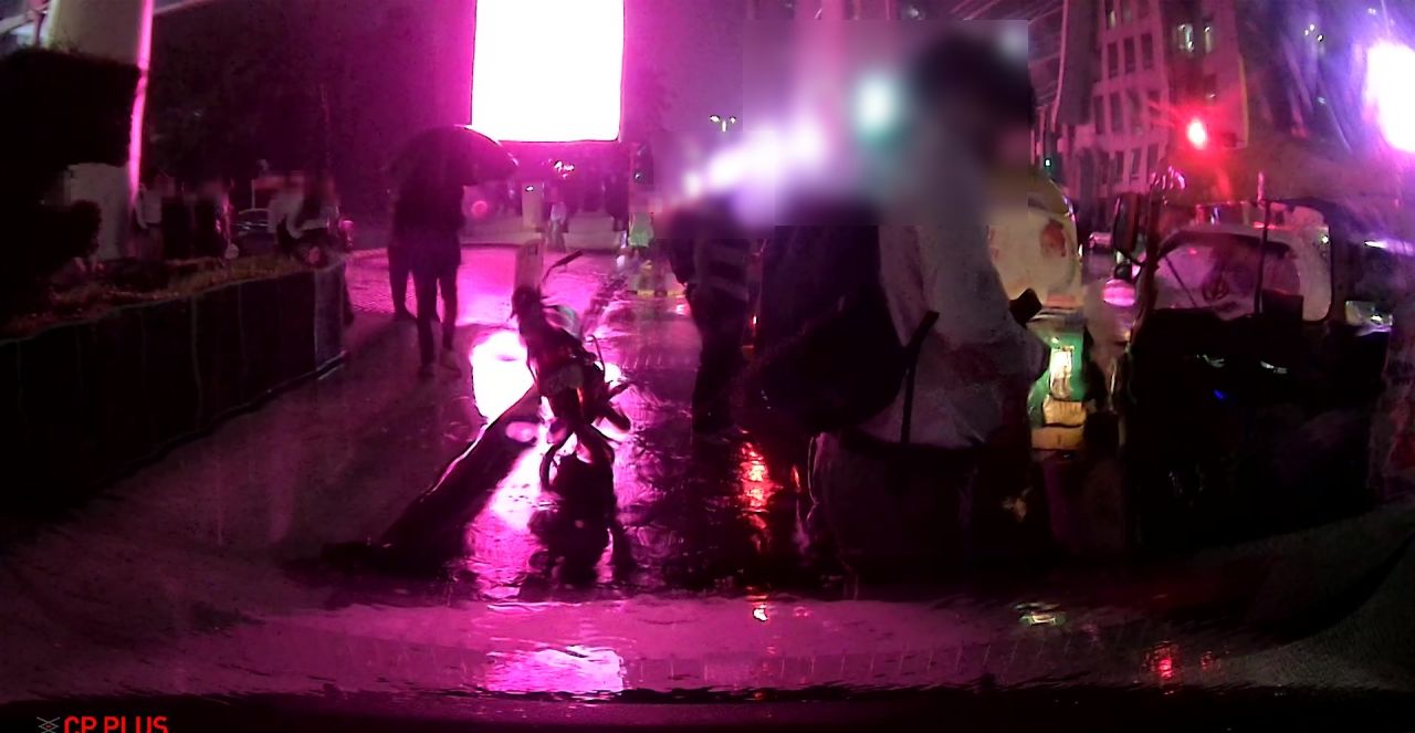 Delhi NCR dashcam frame: Night, rain
